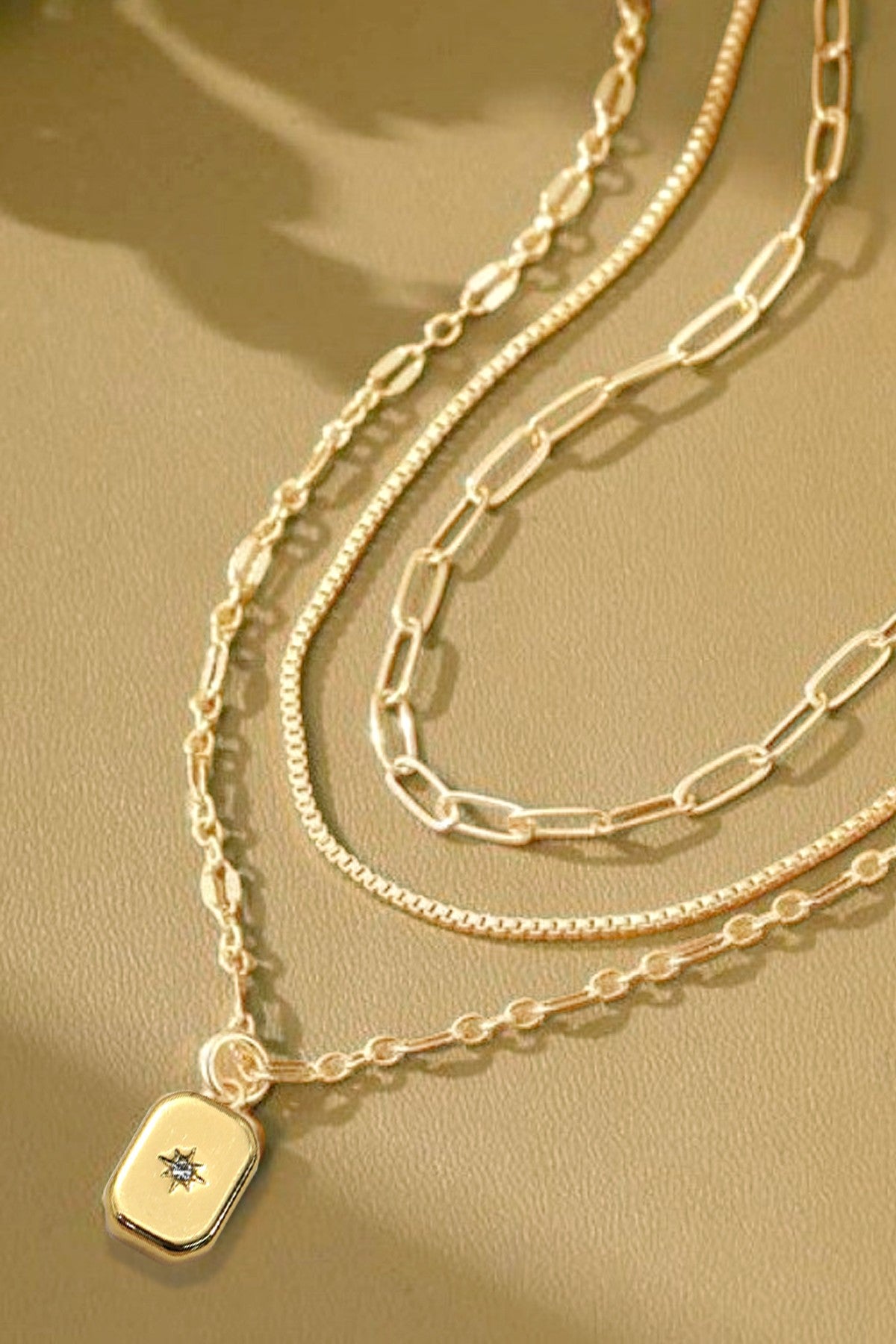 NORTH STAR TRIPLE LAYERED GOLD NECKLACE